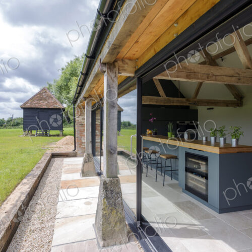 Open-air kitchen and backyard in modern home Open-air kitchen and backyard in modern home