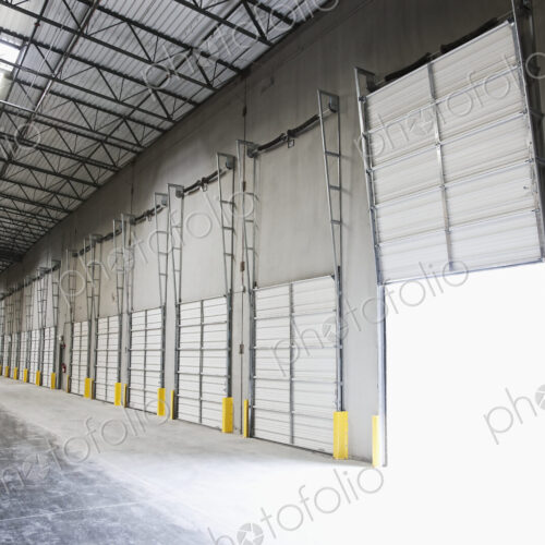 Open door at loading dock in warehouse Open door at loading dock in warehouse