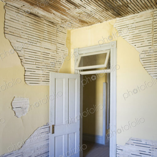 Open door of dilapidated room