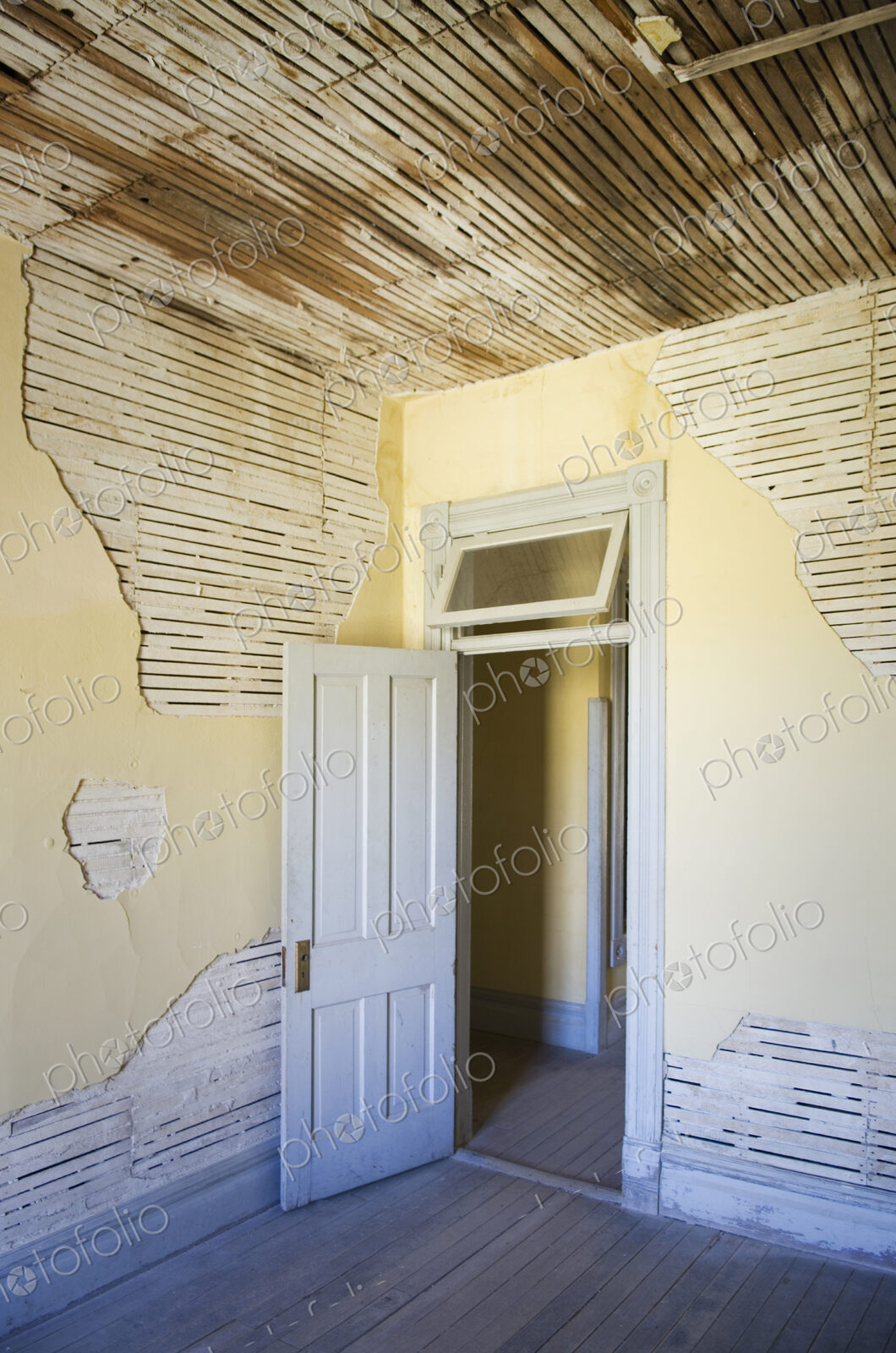 Open door of dilapidated room