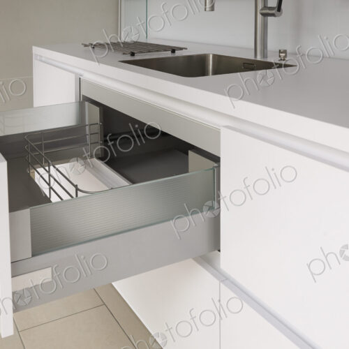 Open drawer in modern kitchen