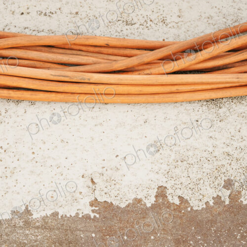Orange cables in a row, on a white background