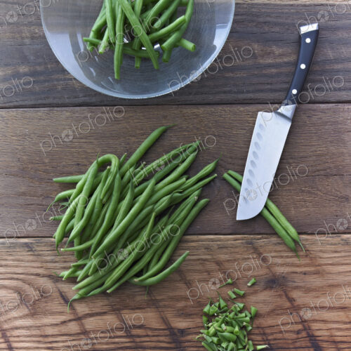 Organic Green Beans Being Prepared for Cooking on Reclaimed Lumber Counter Top