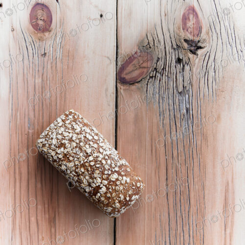 Organic Multi Grain Bread Loaf Cooling on Reclaimed Lumber Table Top