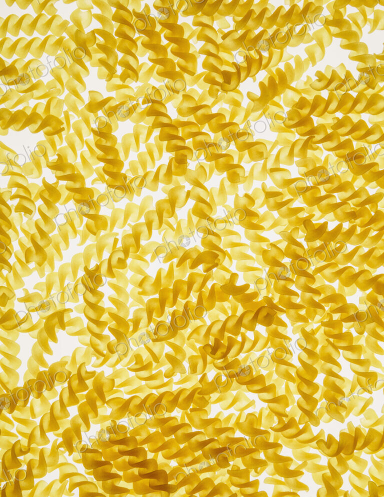 Organic gluten free fusilli pasta spirals, white background