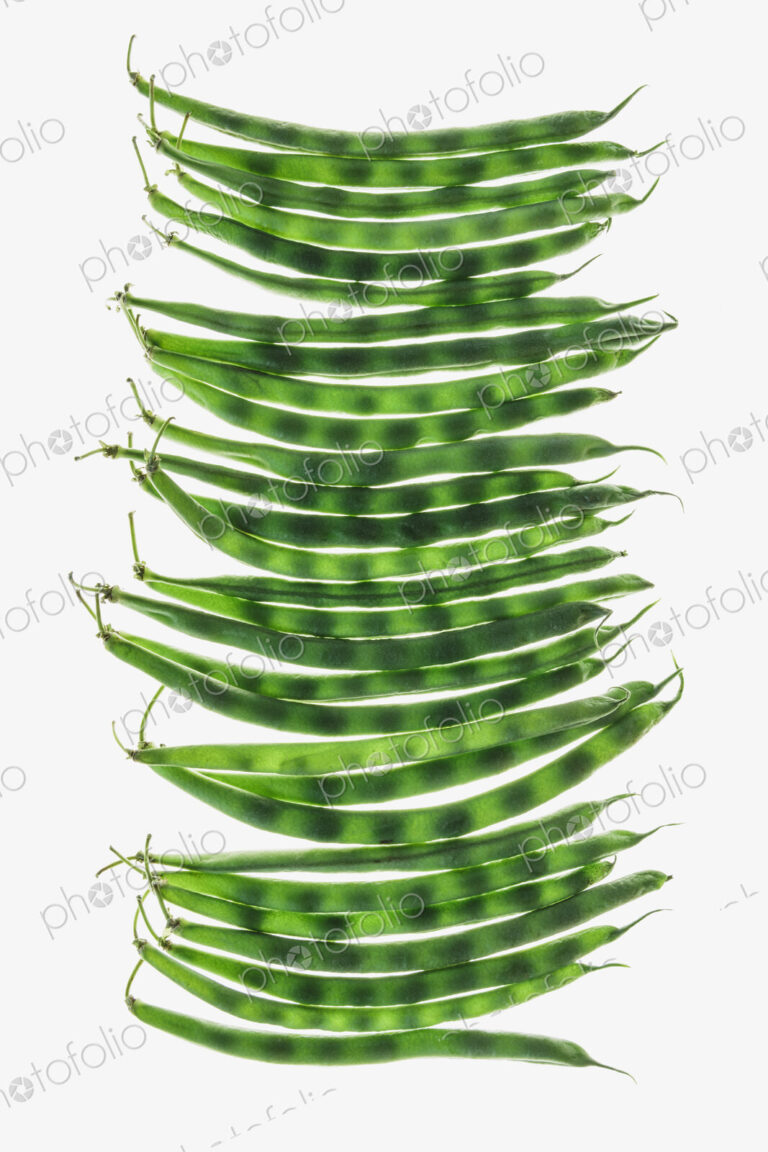 Organic green string beans on white background