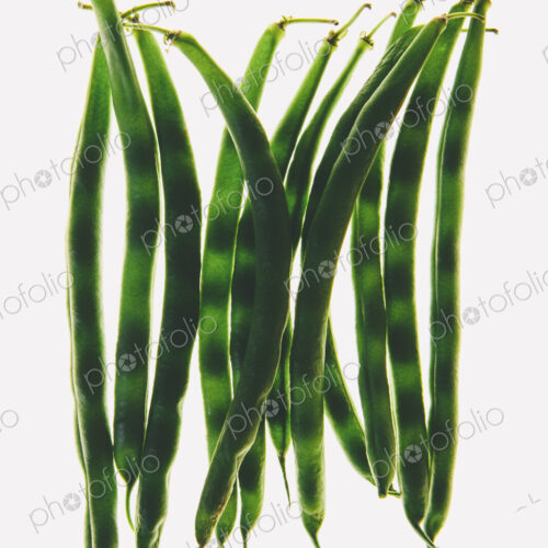 Organic green string beans on white background