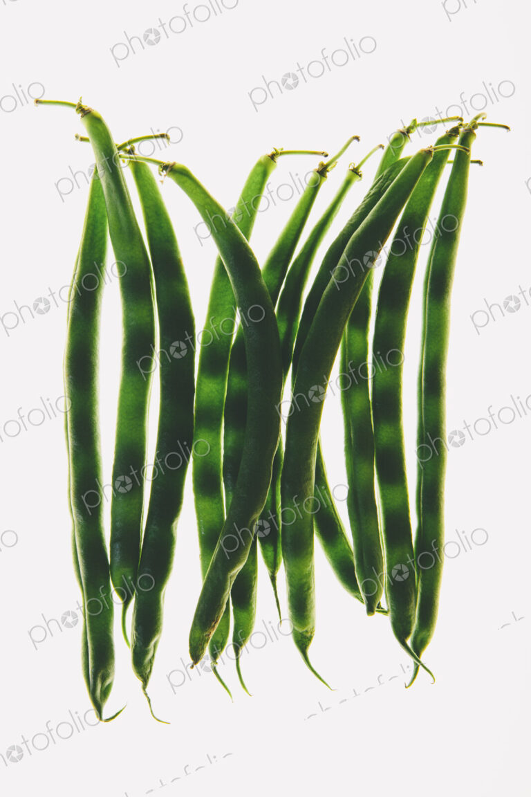 Organic green string beans on white background