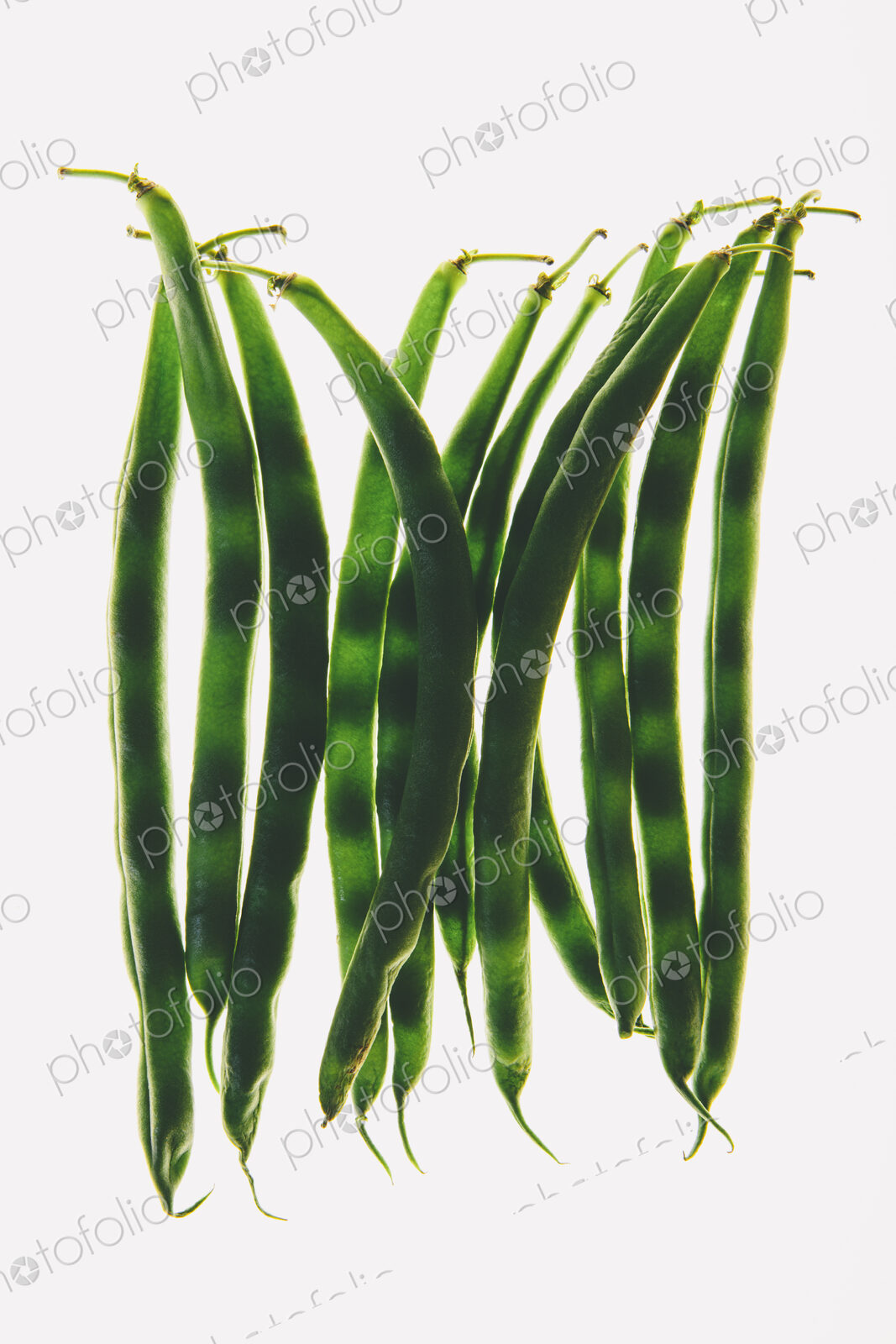 Organic green string beans on white background