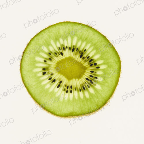 Organic kiwi slice, white background
