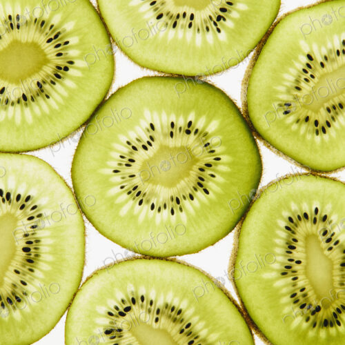 Organic kiwi slices, white background