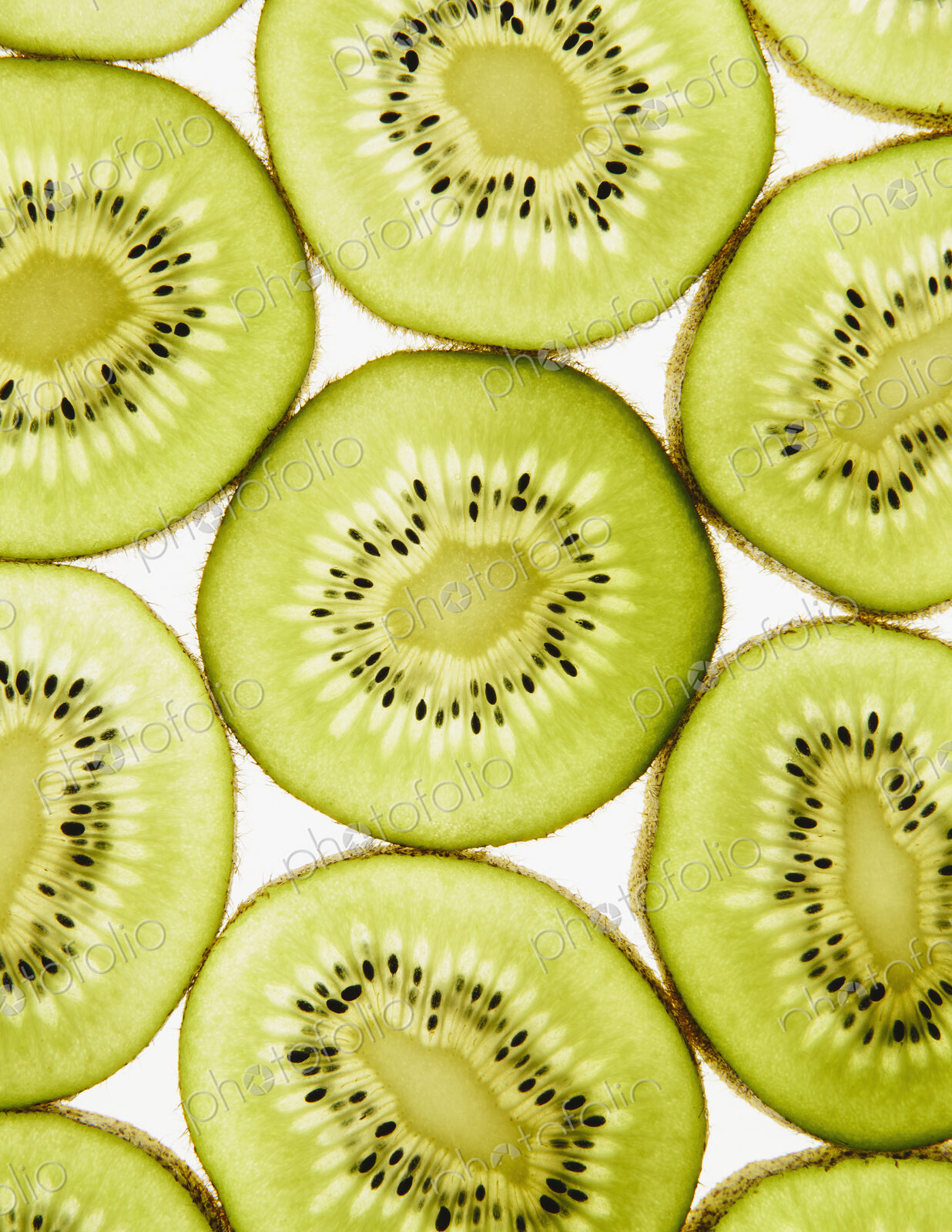 Organic kiwi slices, white background