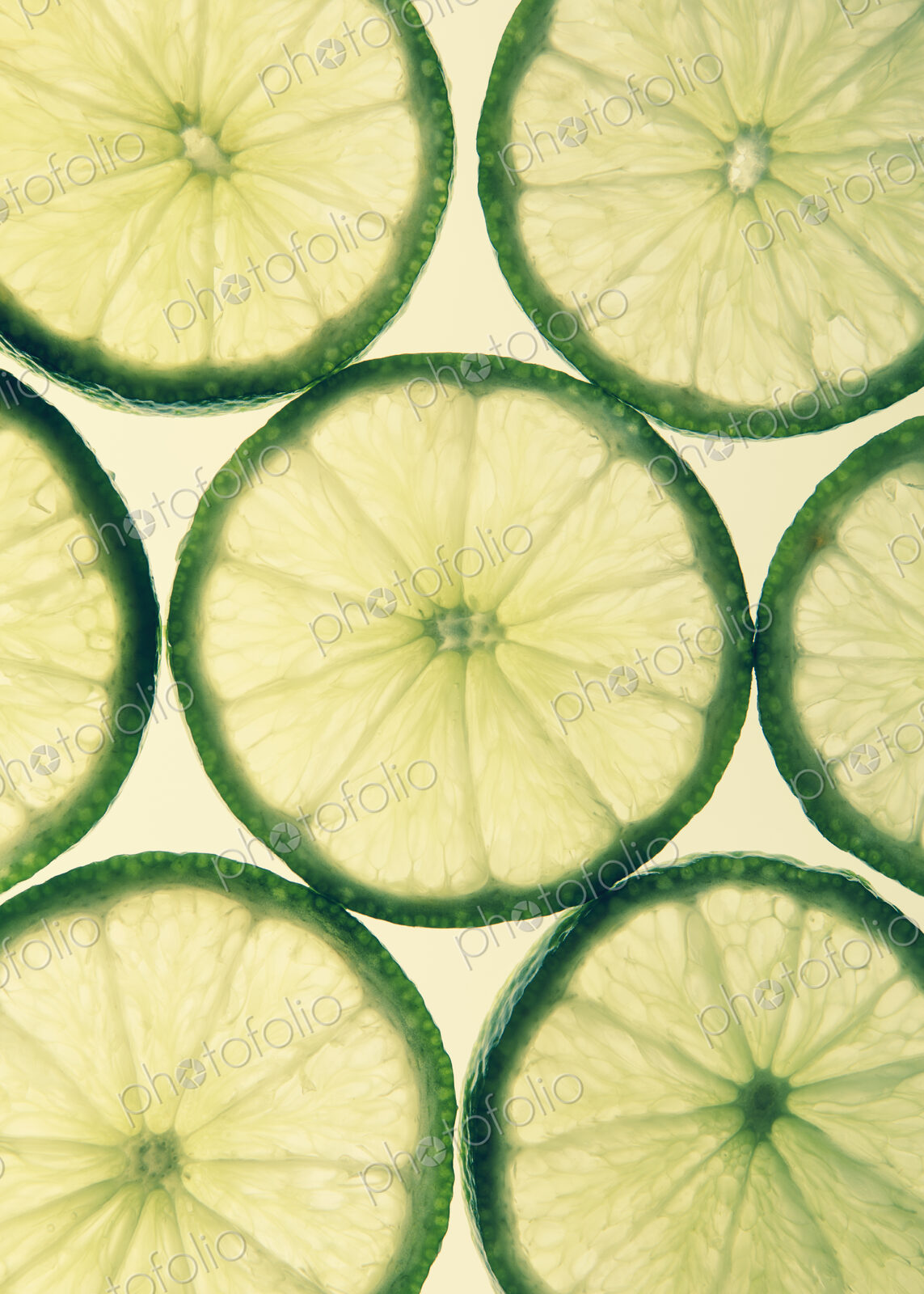 Organic lime slices on white background