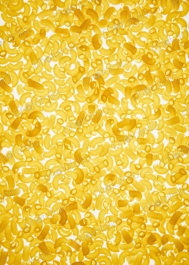 Organic quinoa macaroni pasta elbows, white background (pasta is gluten free)