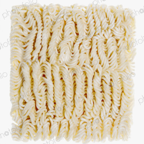 Organic wheat flour ramen noodles, a portion of dried noodles on a white background.