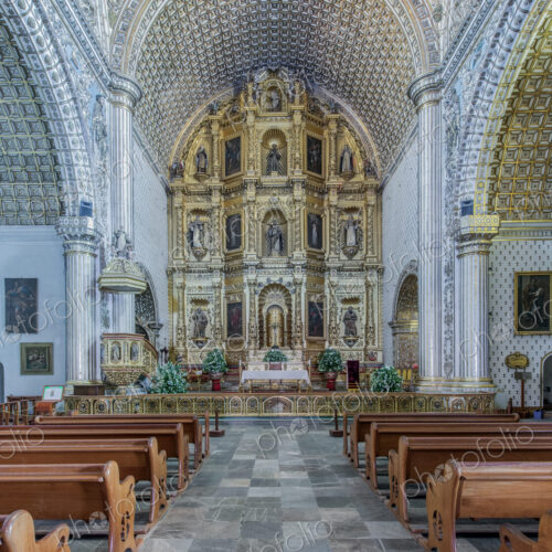 Ornate altar and pews in church Ornate altar and pews in church