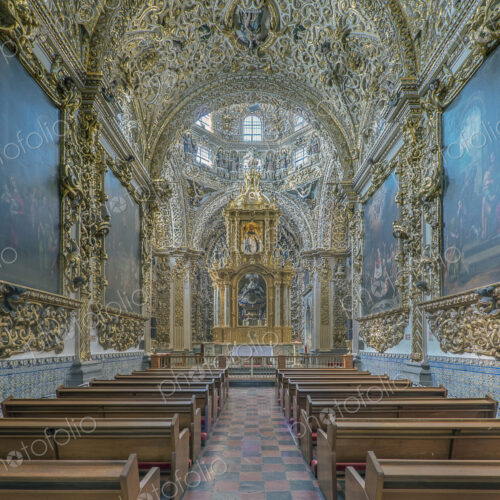 Ornate altar and pews in church Ornate altar and pews in church
