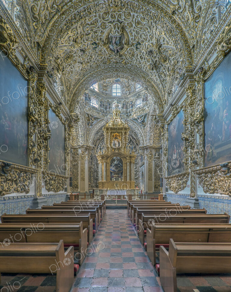 Ornate altar and pews in church
