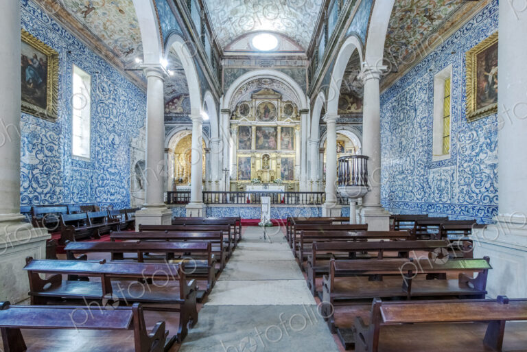Ornate arches and pews in Iglesia de Santa Maria, Obidos, Leiria, Portugal