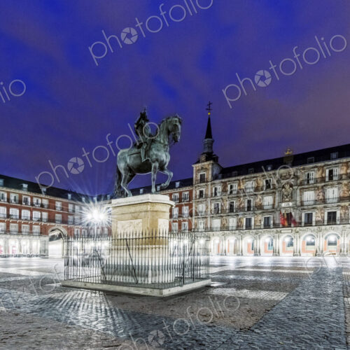 Ornate building and statue illuminated at night, Madrid, Madrid, Spain Ornate building and statue illuminated at night, Madrid, Madrid, Spain