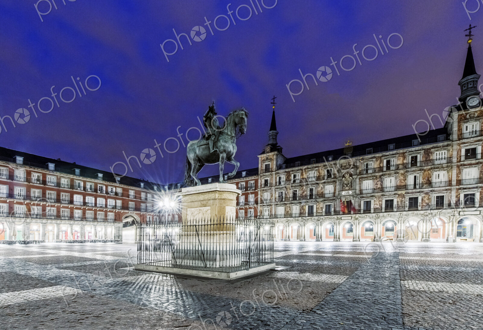Ornate building and statue illuminated at night, Madrid, Madrid, Spain