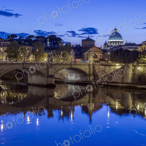 Ornate buildings and bridge illuminated at night, Rome, Italy Ornate buildings and bridge illuminated at night, Rome, Italy