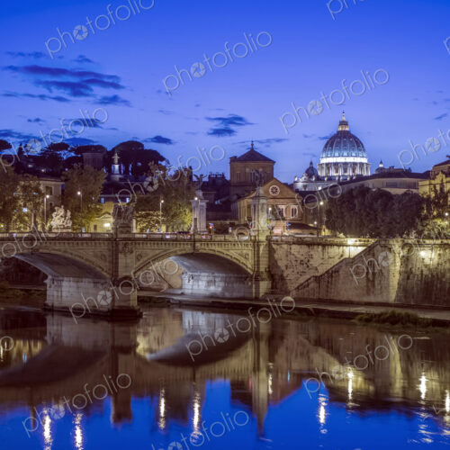 Ornate buildings and bridge illuminated at night, Rome, Italy Ornate buildings and bridge illuminated at night, Rome, Italy