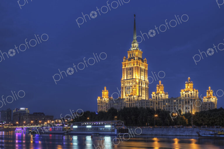 Ornate buildings illuminated at night, Moscow, Russia