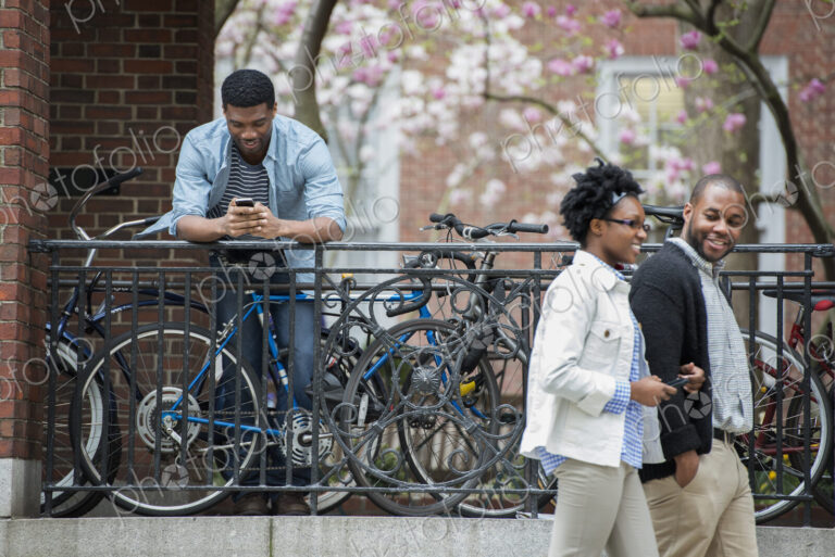 Outdoors in the city in spring. An urban lifestyle. A bicycle rack with locked…