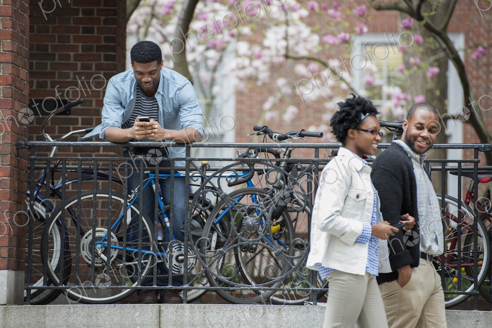 Outdoors in the city in spring. An urban lifestyle. A bicycle rack with locked…