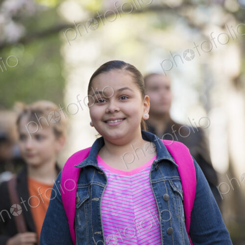 Outdoors in the city in spring. An urban lifestyle. A group of children on the… Outdoors in the city in spring. An urban lifestyle. A group of children on the…