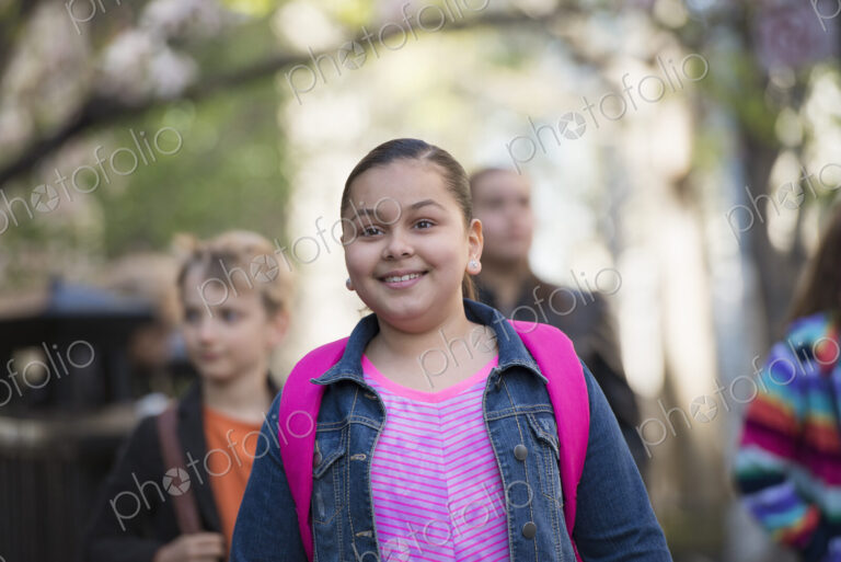 Outdoors in the city in spring. An urban lifestyle. A group of children on the…