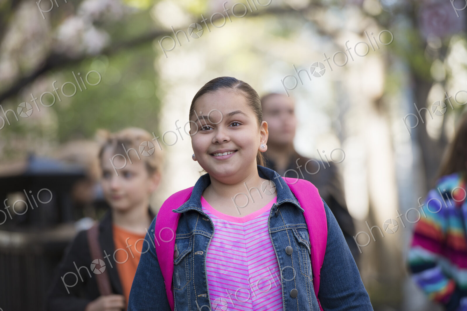 Outdoors in the city in spring. An urban lifestyle. A group of children on the…