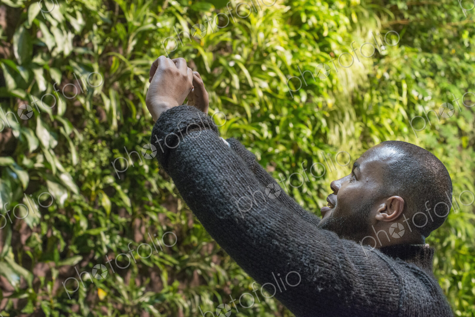 Outdoors in the city in spring. An urban lifestyle. A man taking an image on his…