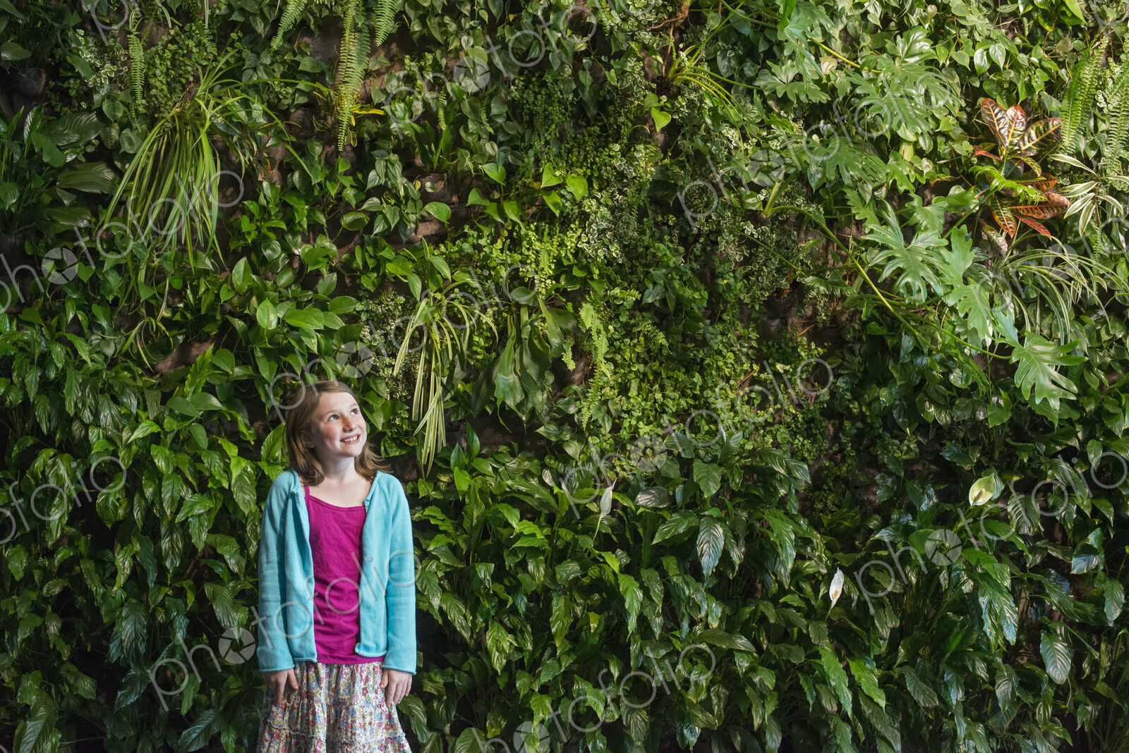 Outdoors in the city in spring. An urban lifestyle. A young girl standing in front of…