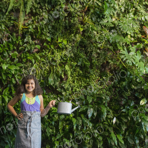 Outdoors in the city in spring. An urban lifestyle. A young girl standing in front of…