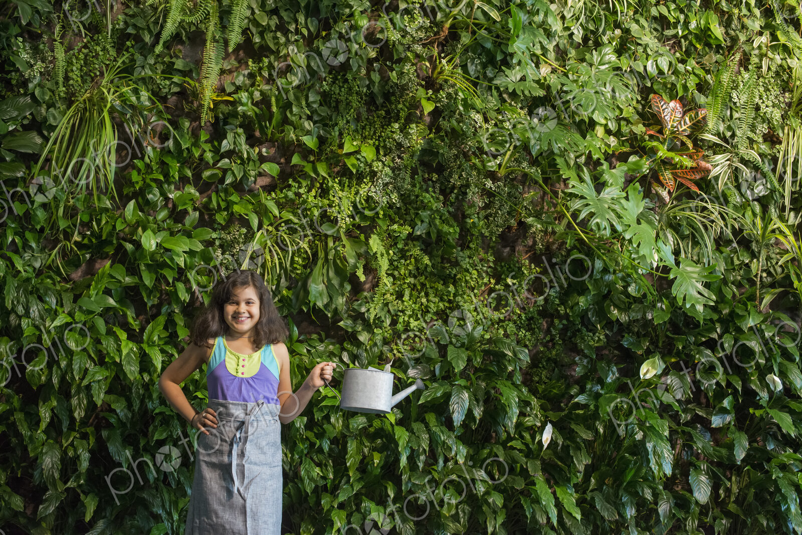 Outdoors in the city in spring. An urban lifestyle. A young girl standing in front of…