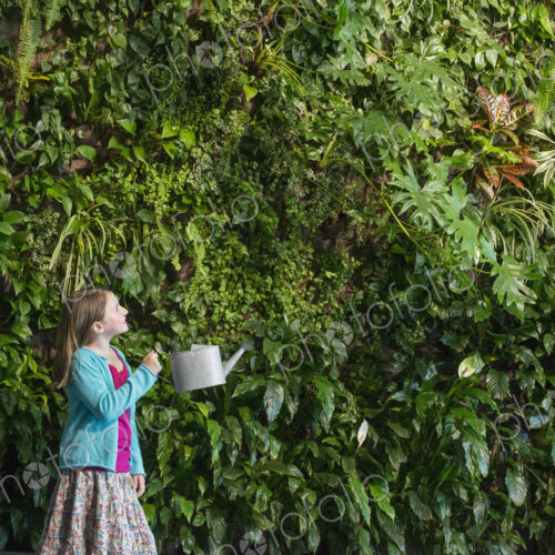 Outdoors in the city in spring. An urban lifestyle. A young girl standing in front of… Outdoors in the city in spring. An urban lifestyle. A young girl standing in front of…