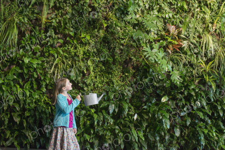 Outdoors in the city in spring. An urban lifestyle. A young girl standing in front of…