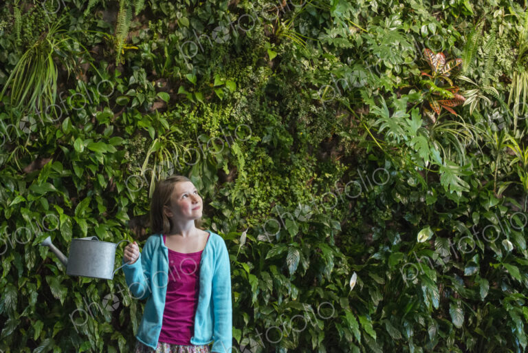 Outdoors in the city in spring. An urban lifestyle. A young girl standing in front of…