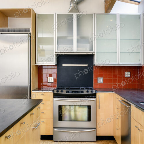 Oven, countertop and cabinets in modern kitchen