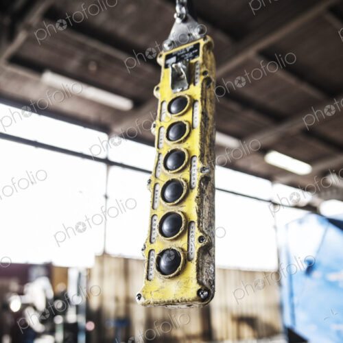 Overhead lift control unit used in a sheet metal factory.