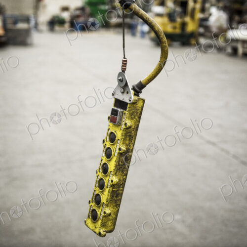 Overhead lift control unit used in a sheet metal factory.