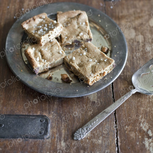 Overhead view. A tray bake, cake or biscuits cut into squares. Organic food. Overhead view. A tray bake, cake or biscuits cut into squares. Organic food.