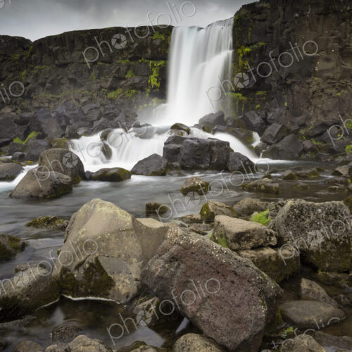 Oxararfoss in Pingvellir National Park, waterfall cascading over a sheer cliff. Oxararfoss in Pingvellir National Park, waterfall cascading over a sheer cliff.