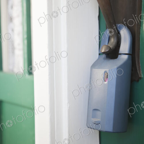Padlock on front door with unsecured door. Padlock on front door with unsecured door.