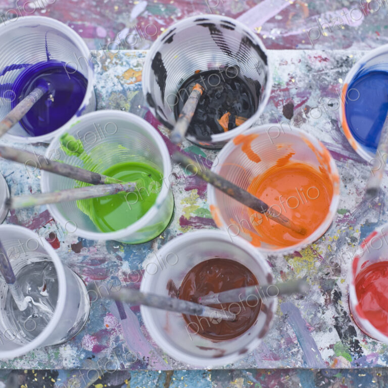 Paints and Brushes in Plastic Cups