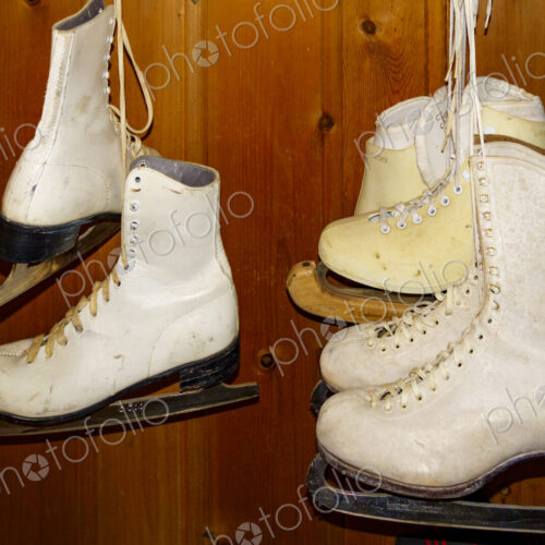 Pairs of ice skates hanging up in a room. Pairs of ice skates hanging up in a room.
