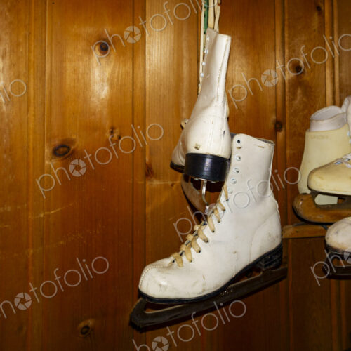 Pairs of ice skates hanging up in a room. Pairs of ice skates hanging up in a room.