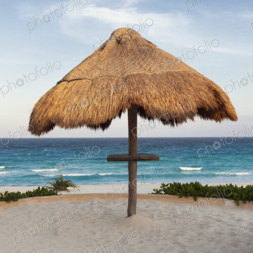 Palapa thatched shade on the beach. Palapa thatched shade on the beach.